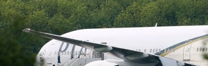 Britain scrambled fighter jets Friday to intercept a commercial airliner carrying more than  people from Pakistan, diverting it to an isolated runway at an airport on the outskirts of London and arresting two British passengers who allegedly threatened to destroy the plane.